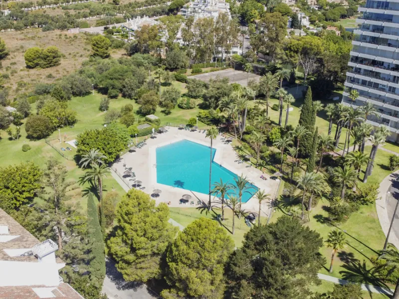 Located in the sought-after Torre Real urbanization, within the distinguished Atenea II building, this refined first-floor apartment offers a serene and comfortable lifestyle just minutes from the heart of Marbella.