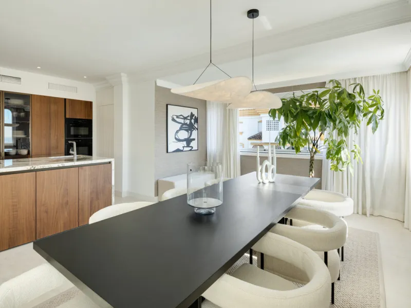 Located in the sought-after area of the Marbella Golden Mile, Costa PH is an exceptional duplex penthouse offering panoramic sea and mountain views. Designed with a modern open-plan layout, the living, dining, and kitchen areas are seamlessly connected, c