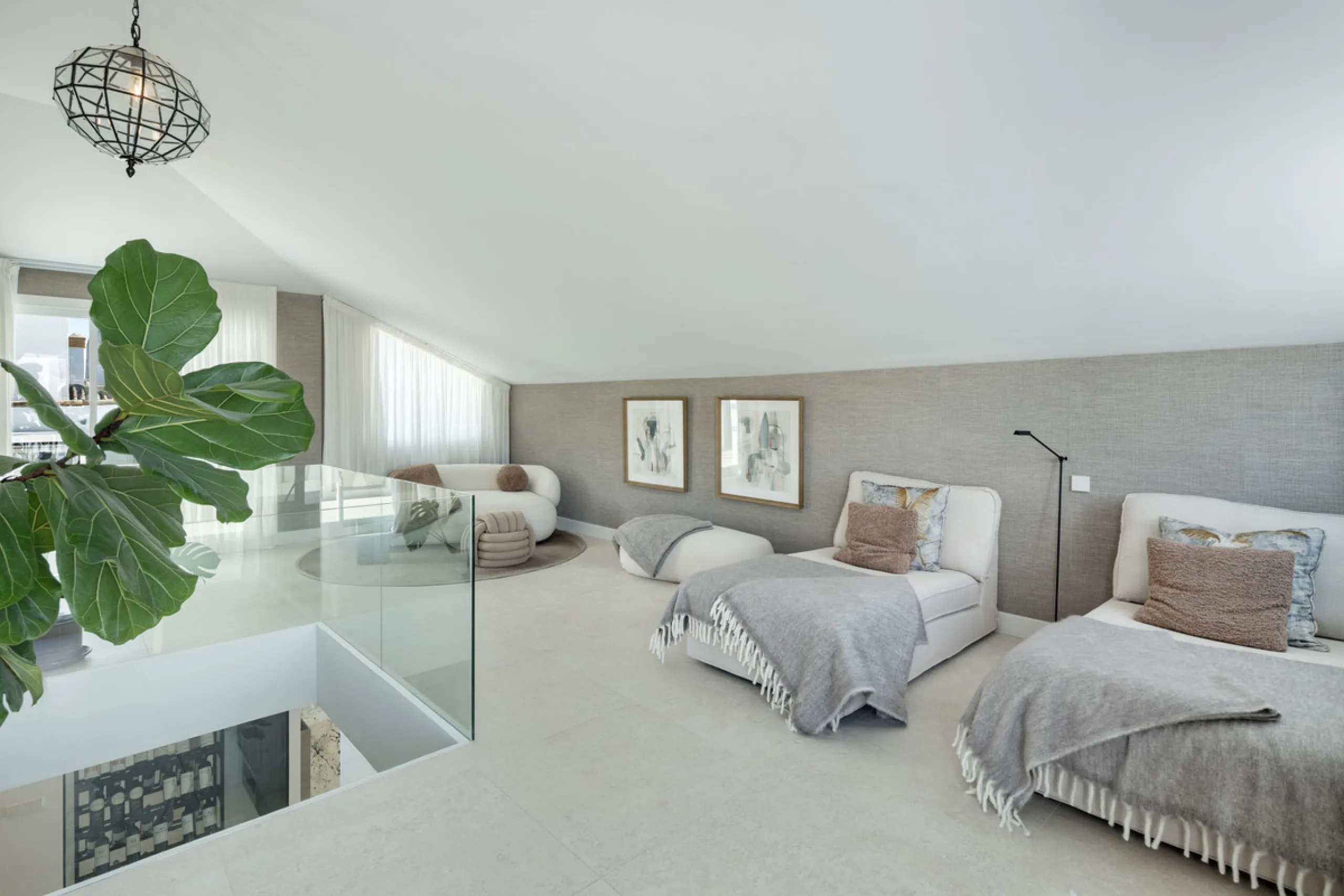Located in the sought-after area of the Marbella Golden Mile, Costa PH is an exceptional duplex penthouse offering panoramic sea and mountain views. Designed with a modern open-plan layout, the living, dining, and kitchen areas are seamlessly connected, c