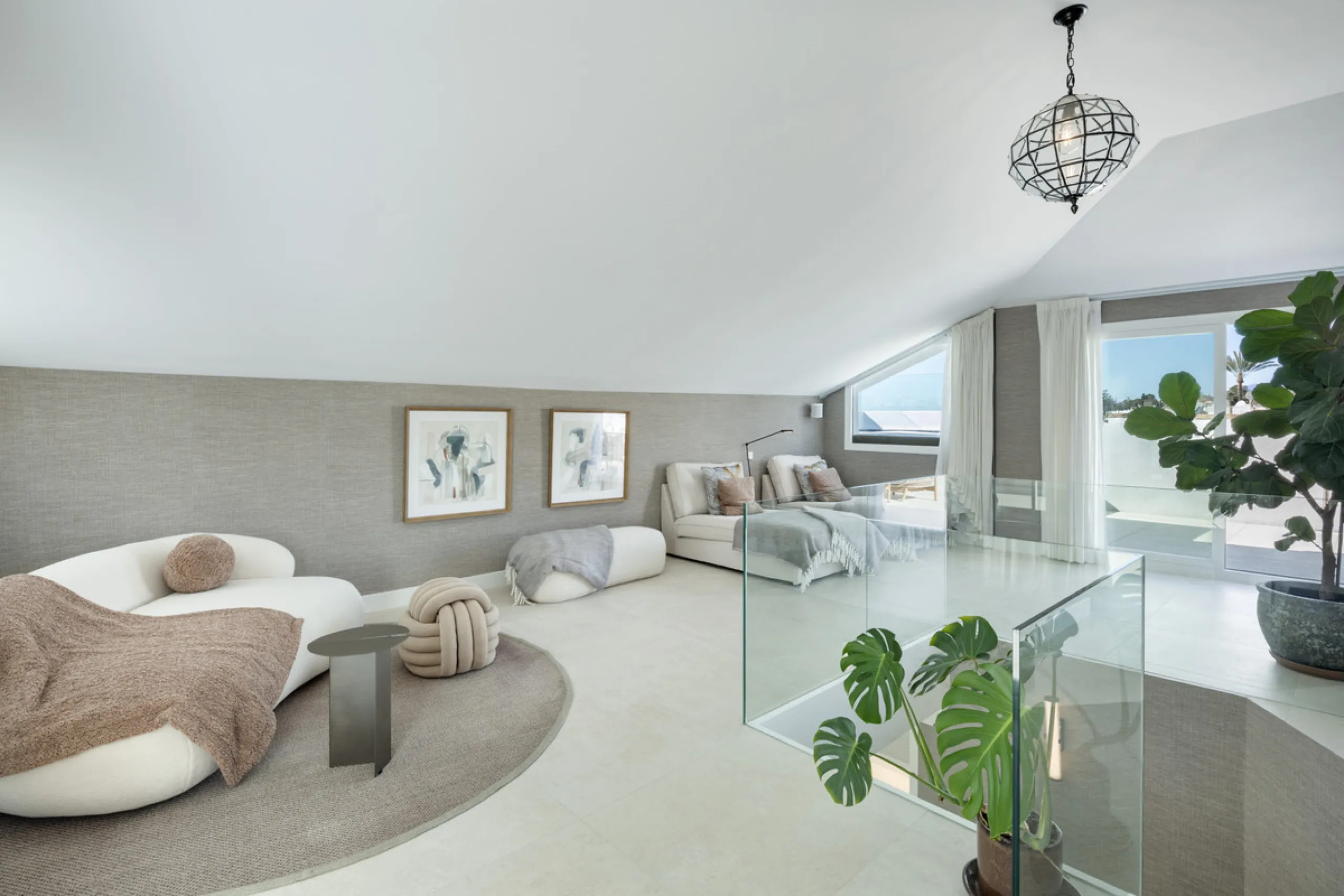 Located in the sought-after area of the Marbella Golden Mile, Costa PH is an exceptional duplex penthouse offering panoramic sea and mountain views. Designed with a modern open-plan layout, the living, dining, and kitchen areas are seamlessly connected, c
