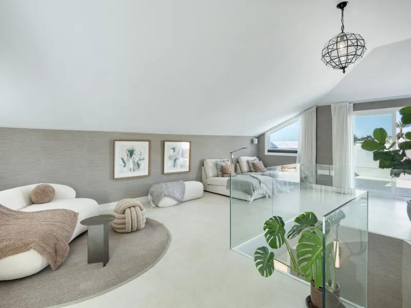 Located in the sought-after area of the Marbella Golden Mile, Costa PH is an exceptional duplex penthouse offering panoramic sea and mountain views. Designed with a modern open-plan layout, the living, dining, and kitchen areas are seamlessly connected, c