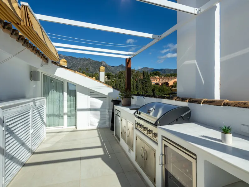 Located in the sought-after area of the Marbella Golden Mile, Costa PH is an exceptional duplex penthouse offering panoramic sea and mountain views. Designed with a modern open-plan layout, the living, dining, and kitchen areas are seamlessly connected, c
