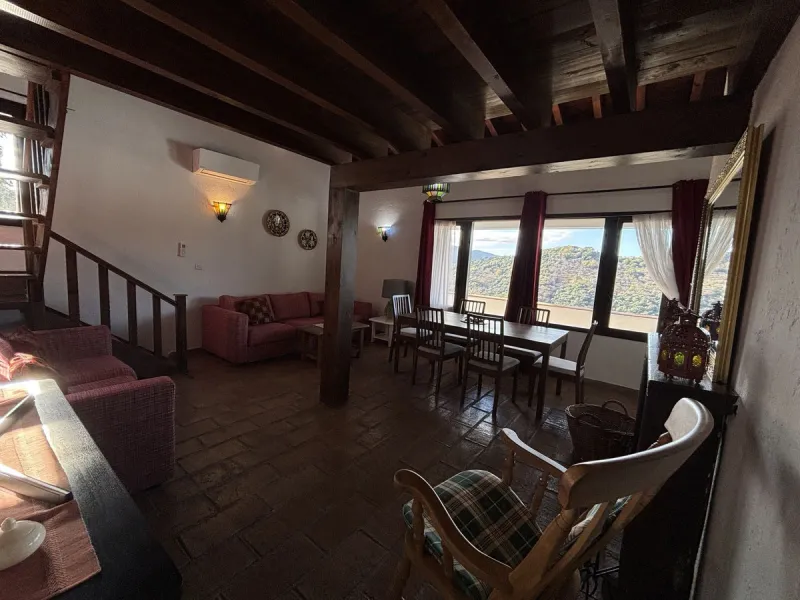 Income potential meets lifestyle in this exceptional multi-unit casa rural on the very edge of Júzcar (Málaga), enjoying breathtaking open views and a wonderfully tranquil setting at the edge of the village. Set on approximately 8,900 m² of land, the prop