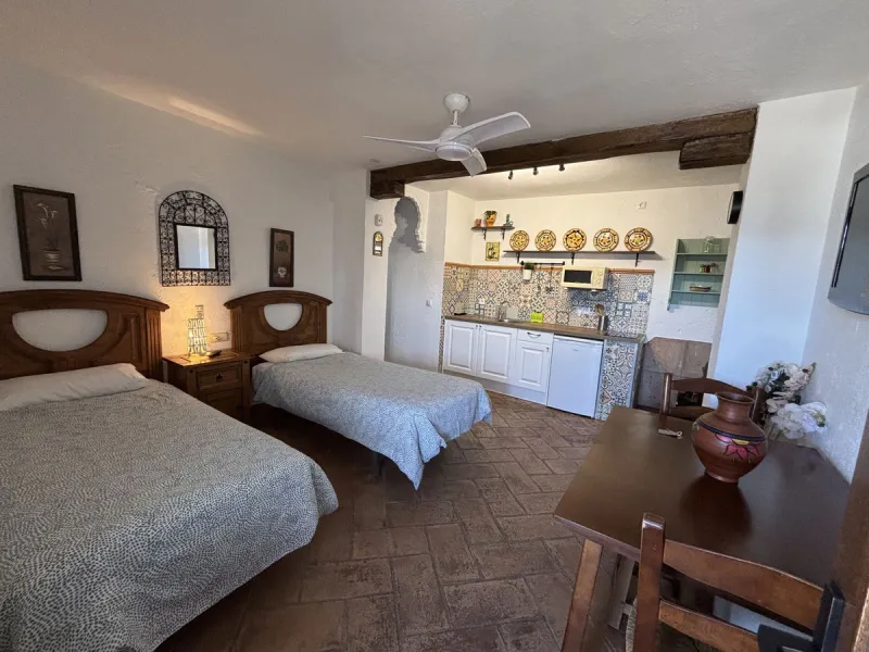 Income potential meets lifestyle in this exceptional multi-unit casa rural on the very edge of Júzcar (Málaga), enjoying breathtaking open views and a wonderfully tranquil setting at the edge of the village. Set on approximately 8,900 m² of land, the prop