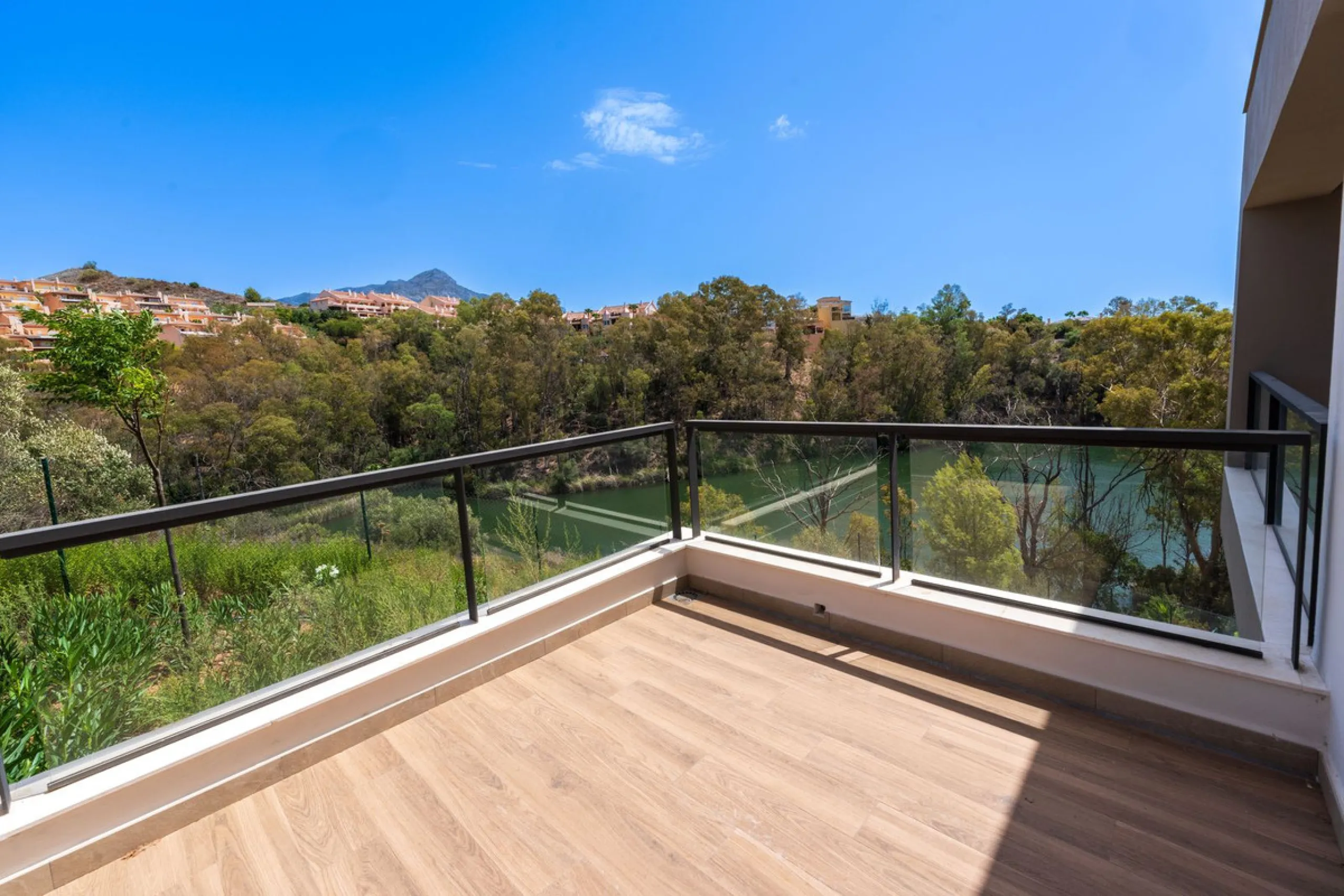 Superb Elevated Corner 3-Bedoom 2-bath Contemporary Apartment with 2 separate balconies set within the sought-after Marbella Lake Development in the Golf Valley.