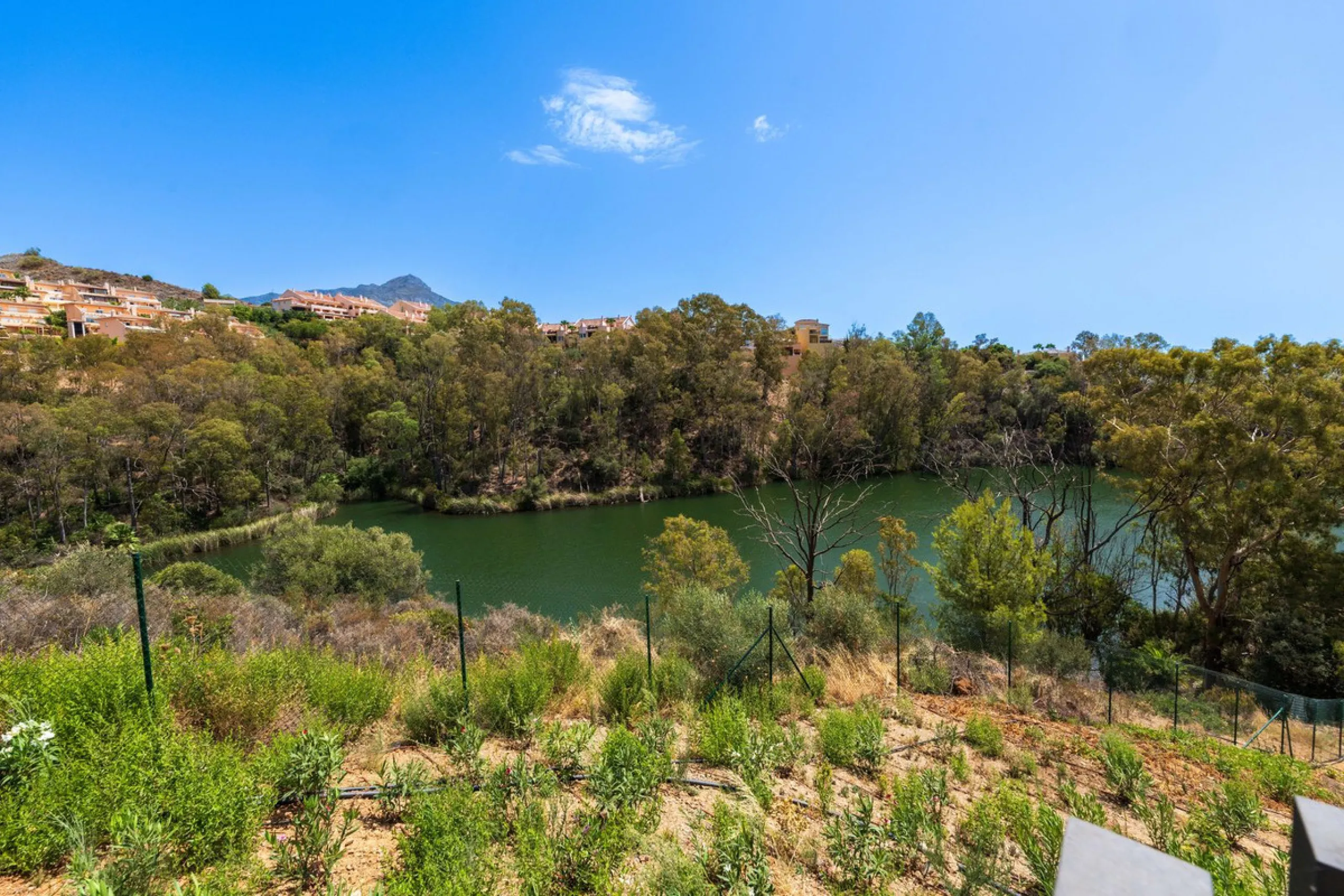 Superb Elevated Corner 3-Bedoom 2-bath Contemporary Apartment with 2 separate balconies set within the sought-after Marbella Lake Development in the Golf Valley.