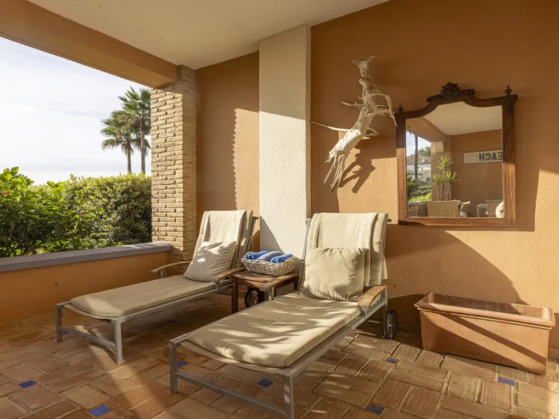 Wake up to breathtaking sea views from this exceptional 3-bedroom, 2-bathroom ground floor apartment set within one of the most prestigious frontline beach urbanisations in Casares Costa. With a spacious terrace overlooking beautifully landscaped gardens 