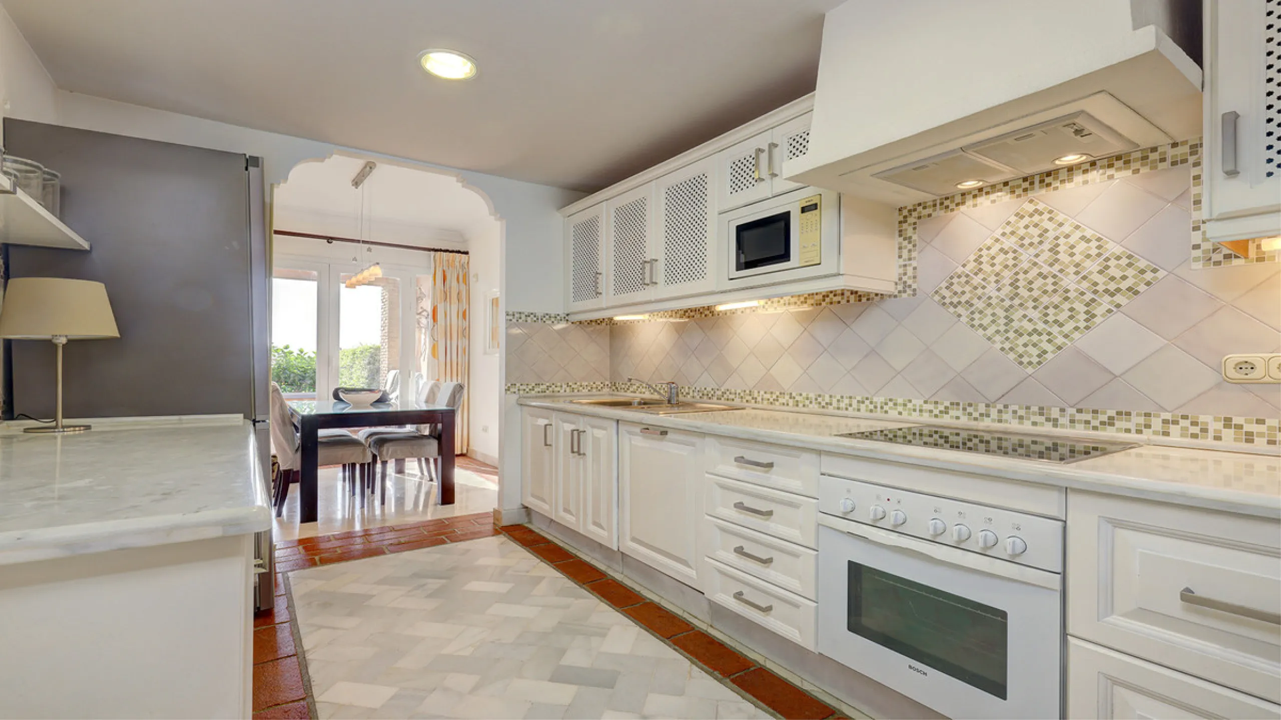 Wake up to breathtaking sea views from this exceptional 3-bedroom, 2-bathroom ground floor apartment set within one of the most prestigious frontline beach urbanisations in Casares Costa. With a spacious terrace overlooking beautifully landscaped gardens 