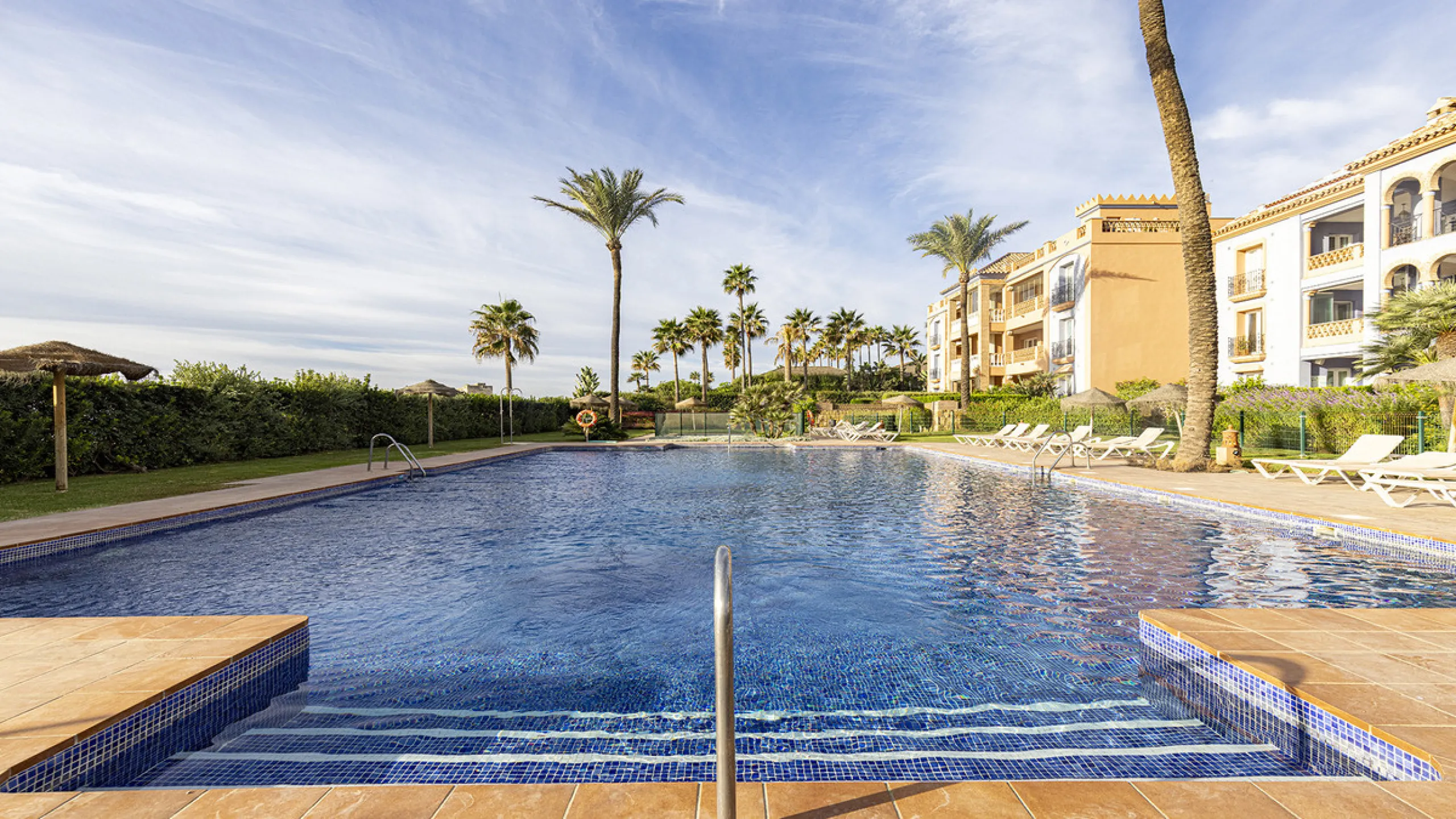 Wake up to breathtaking sea views from this exceptional 3-bedroom, 2-bathroom ground floor apartment set within one of the most prestigious frontline beach urbanisations in Casares Costa. With a spacious terrace overlooking beautifully landscaped gardens 
