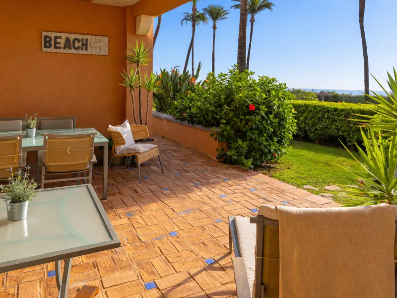 Wake up to breathtaking sea views from this exceptional 3-bedroom, 2-bathroom ground floor apartment set within one of the most prestigious frontline beach urbanisations in Casares Costa. With a spacious terrace overlooking beautifully landscaped gardens 