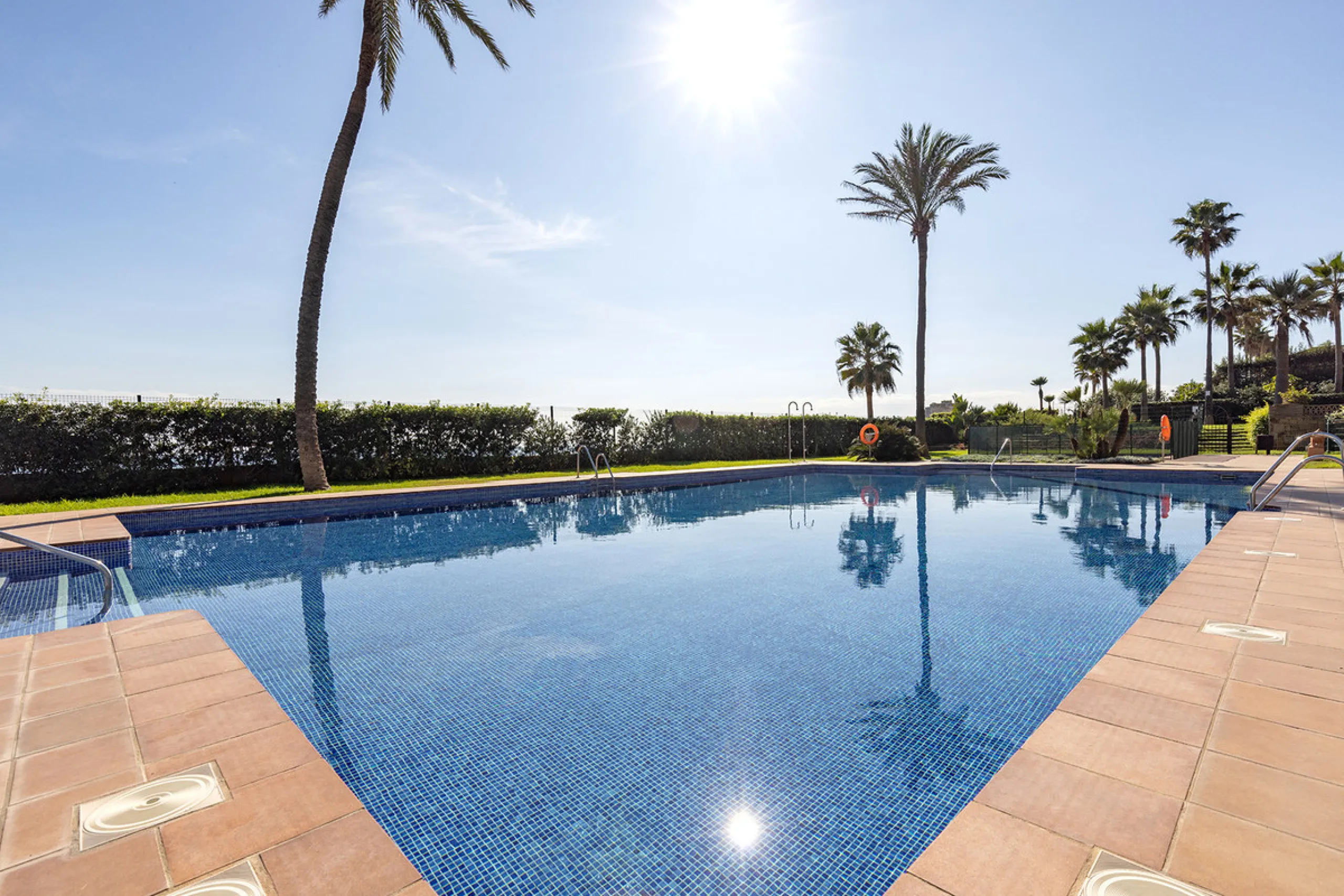 Wake up to breathtaking sea views from this exceptional 3-bedroom, 2-bathroom ground floor apartment set within one of the most prestigious frontline beach urbanisations in Casares Costa. With a spacious terrace overlooking beautifully landscaped gardens 