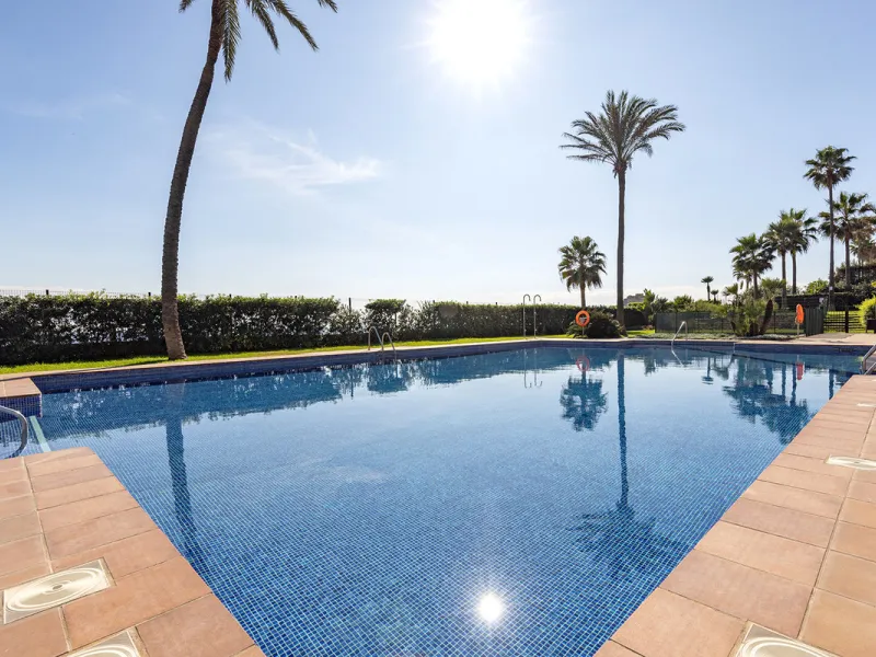 Wake up to breathtaking sea views from this exceptional 3-bedroom, 2-bathroom ground floor apartment set within one of the most prestigious frontline beach urbanisations in Casares Costa. With a spacious terrace overlooking beautifully landscaped gardens 