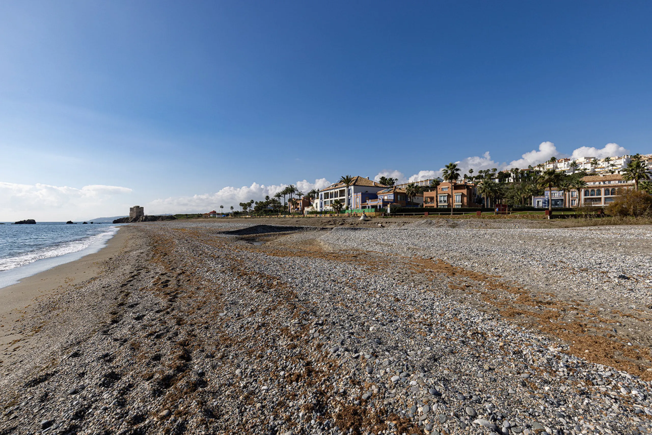 Wake up to breathtaking sea views from this exceptional 3-bedroom, 2-bathroom ground floor apartment set within one of the most prestigious frontline beach urbanisations in Casares Costa. With a spacious terrace overlooking beautifully landscaped gardens 