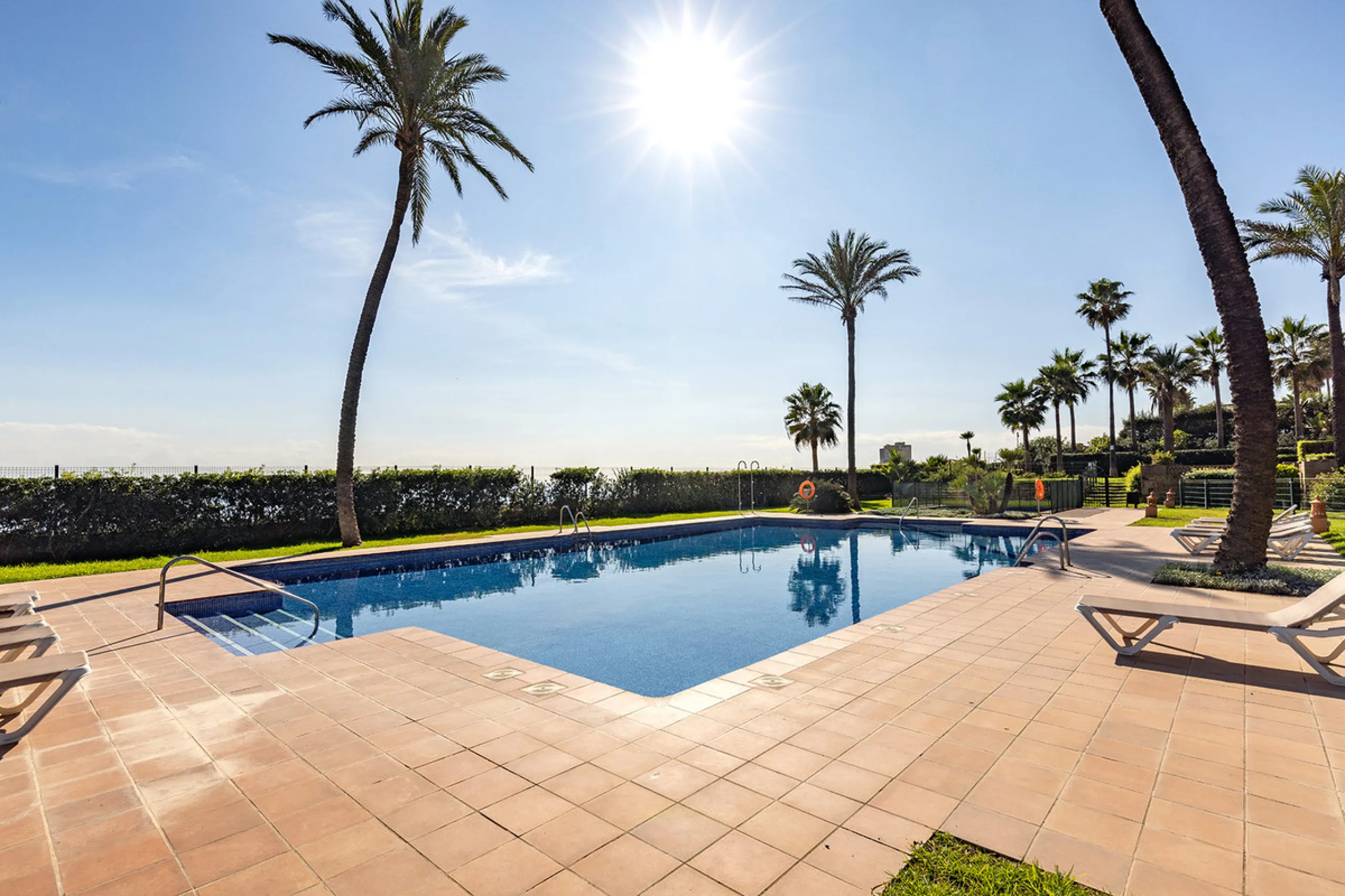Wake up to breathtaking sea views from this exceptional 3-bedroom, 2-bathroom ground floor apartment set within one of the most prestigious frontline beach urbanisations in Casares Costa. With a spacious terrace overlooking beautifully landscaped gardens 