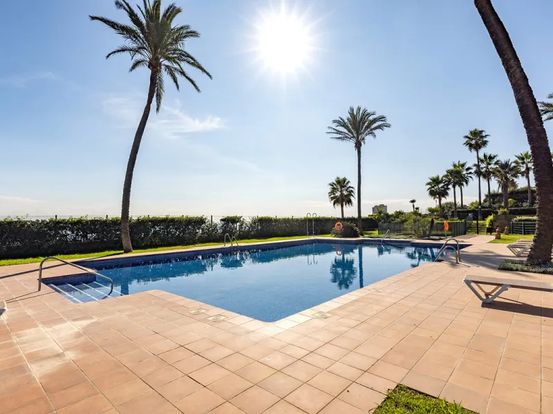 Wake up to breathtaking sea views from this exceptional 3-bedroom, 2-bathroom ground floor apartment set within one of the most prestigious frontline beach urbanisations in Casares Costa. With a spacious terrace overlooking beautifully landscaped gardens 