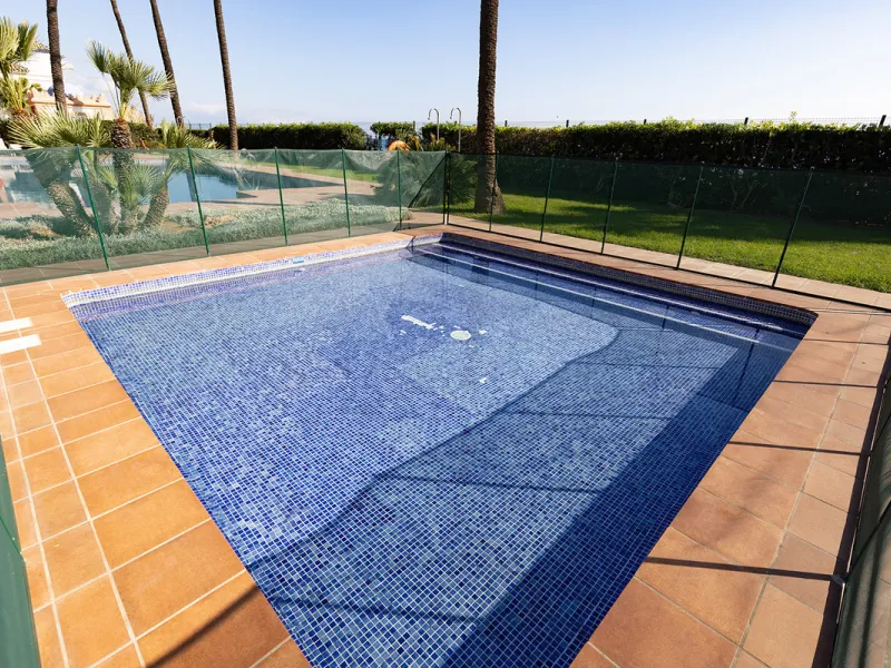 Wake up to breathtaking sea views from this exceptional 3-bedroom, 2-bathroom ground floor apartment set within one of the most prestigious frontline beach urbanisations in Casares Costa. With a spacious terrace overlooking beautifully landscaped gardens 