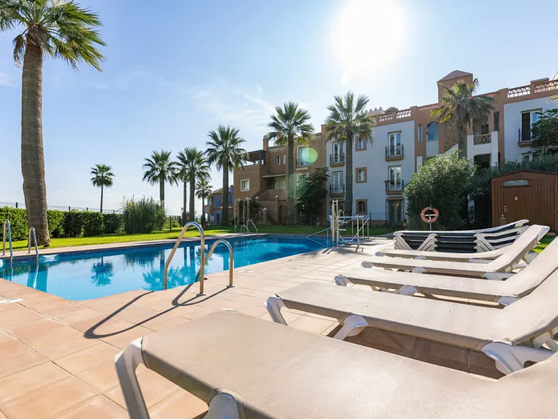 Wake up to breathtaking sea views from this exceptional 3-bedroom, 2-bathroom ground floor apartment set within one of the most prestigious frontline beach urbanisations in Casares Costa. With a spacious terrace overlooking beautifully landscaped gardens 