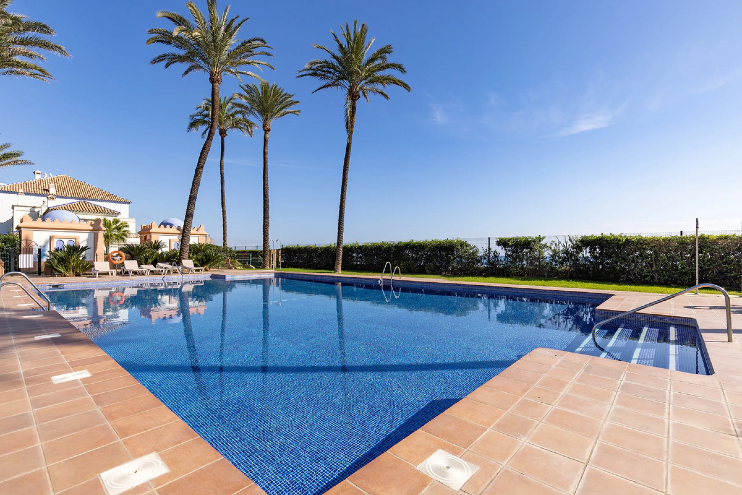 Wake up to breathtaking sea views from this exceptional 3-bedroom, 2-bathroom ground floor apartment set within one of the most prestigious frontline beach urbanisations in Casares Costa. With a spacious terrace overlooking beautifully landscaped gardens 