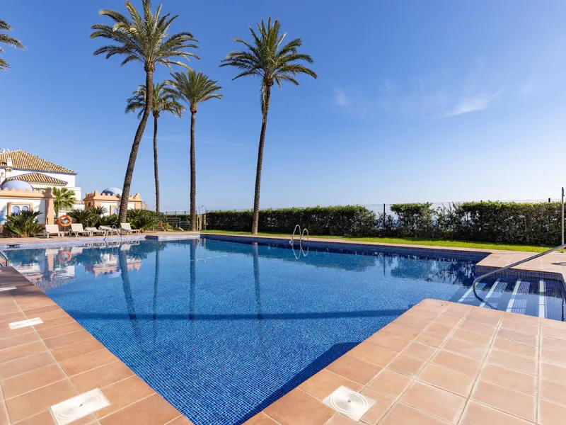 Wake up to breathtaking sea views from this exceptional 3-bedroom, 2-bathroom ground floor apartment set within one of the most prestigious frontline beach urbanisations in Casares Costa. With a spacious terrace overlooking beautifully landscaped gardens 