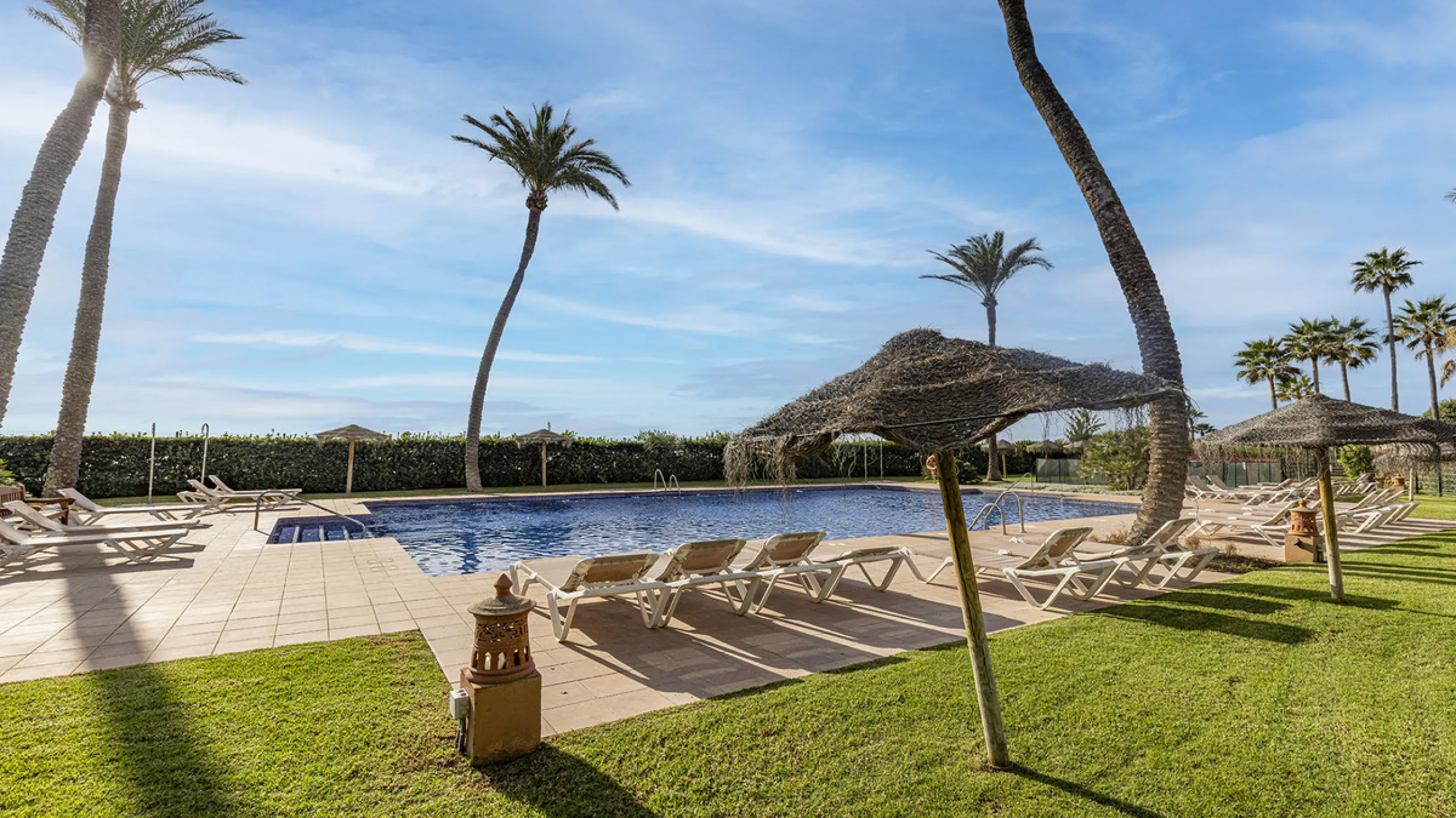Wake up to breathtaking sea views from this exceptional 3-bedroom, 2-bathroom ground floor apartment set within one of the most prestigious frontline beach urbanisations in Casares Costa. With a spacious terrace overlooking beautifully landscaped gardens 