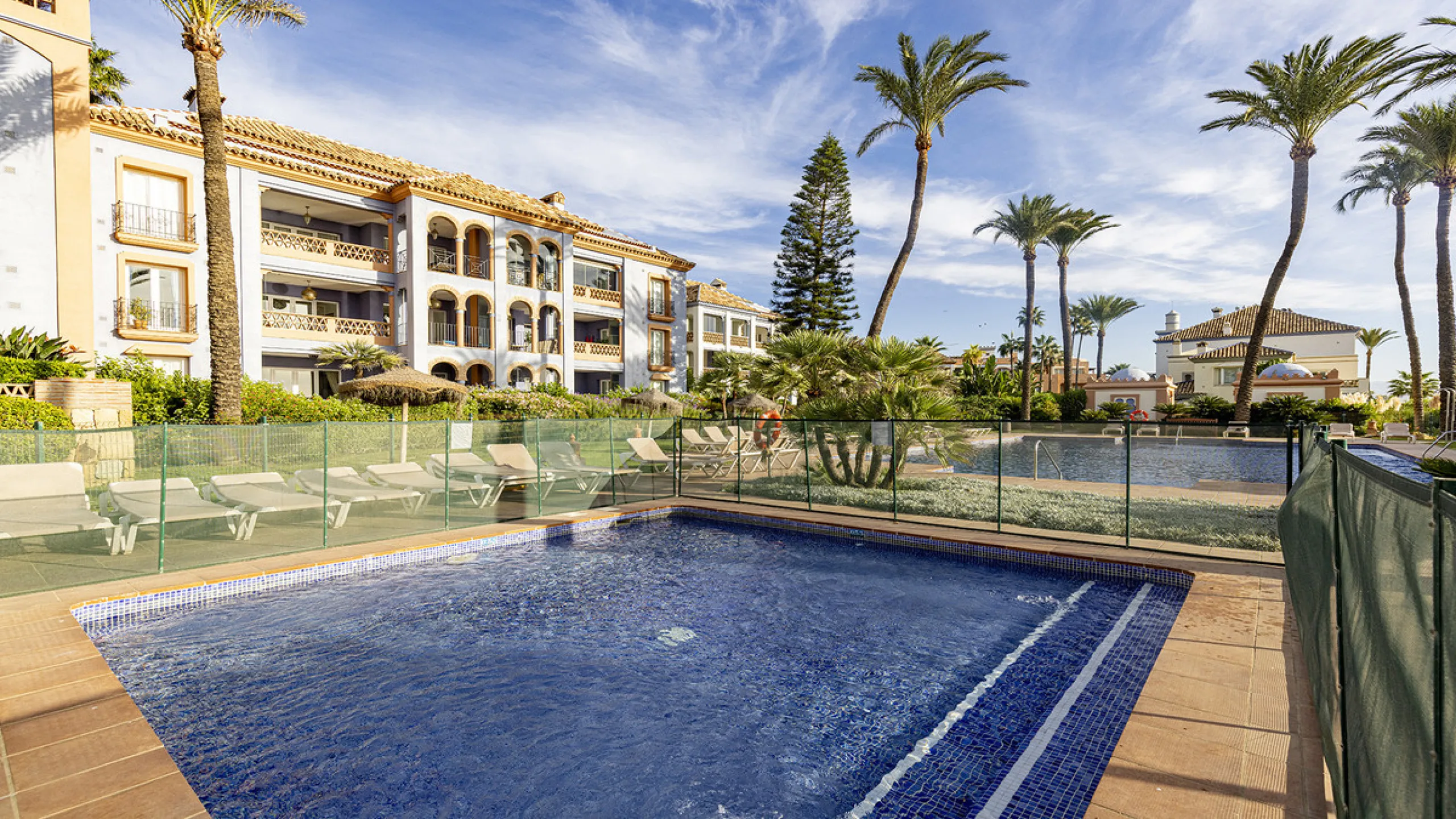 Wake up to breathtaking sea views from this exceptional 3-bedroom, 2-bathroom ground floor apartment set within one of the most prestigious frontline beach urbanisations in Casares Costa. With a spacious terrace overlooking beautifully landscaped gardens 