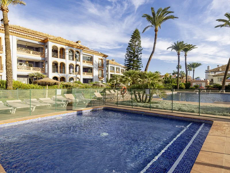 Wake up to breathtaking sea views from this exceptional 3-bedroom, 2-bathroom ground floor apartment set within one of the most prestigious frontline beach urbanisations in Casares Costa. With a spacious terrace overlooking beautifully landscaped gardens 