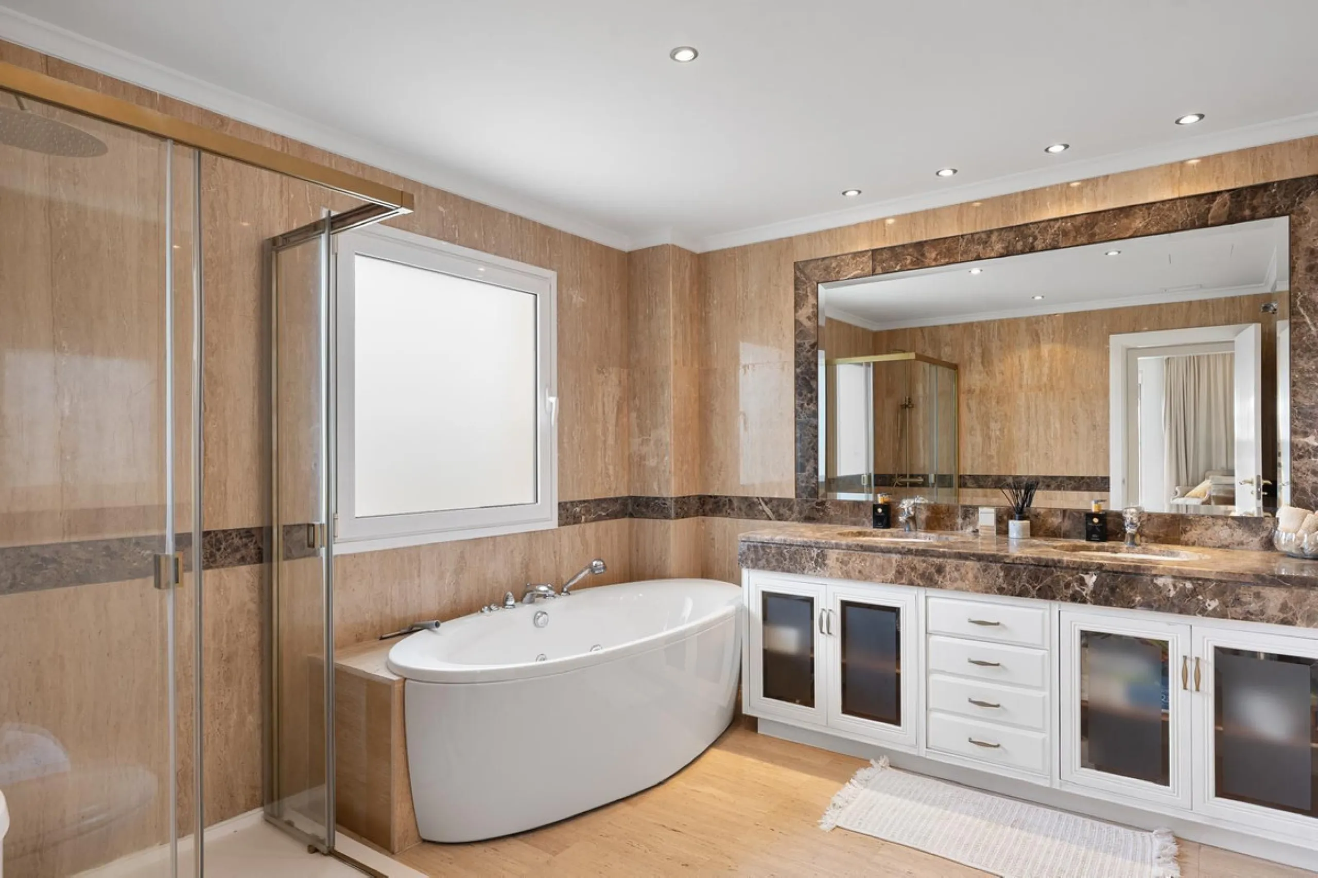 Available for short-term stays, this impressive top-floor apartment offers a rare combination of space, comfort, and security within an exclusive gated complex. With three bedrooms and five bathrooms, the property is perfectly suited for families or group