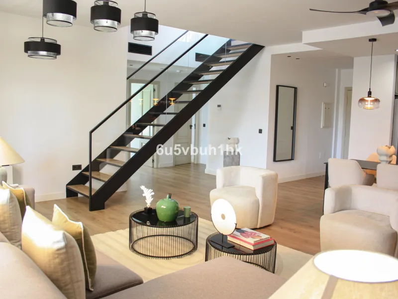 Experience the perfect harmony of luxury, comfort, and stunning panoramic views in this exceptional duplex penthouse, completely renovated and located on Marbella's prestigious Golden Mile.