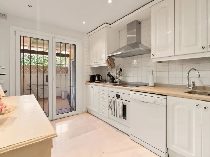 Superb spacious townhouse located in one of the most sought after urbanisations in Guadalmina Baja. Set in sumptuous landscaped gardens with a generous sized swimming pool. The property is on two storeys with a large storage in the basement and double gar