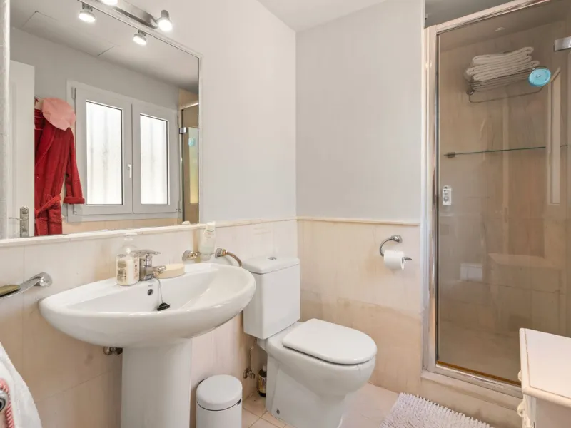 Superb spacious townhouse located in one of the most sought after urbanisations in Guadalmina Baja. Set in sumptuous landscaped gardens with a generous sized swimming pool. The property is on two storeys with a large storage in the basement and double gar