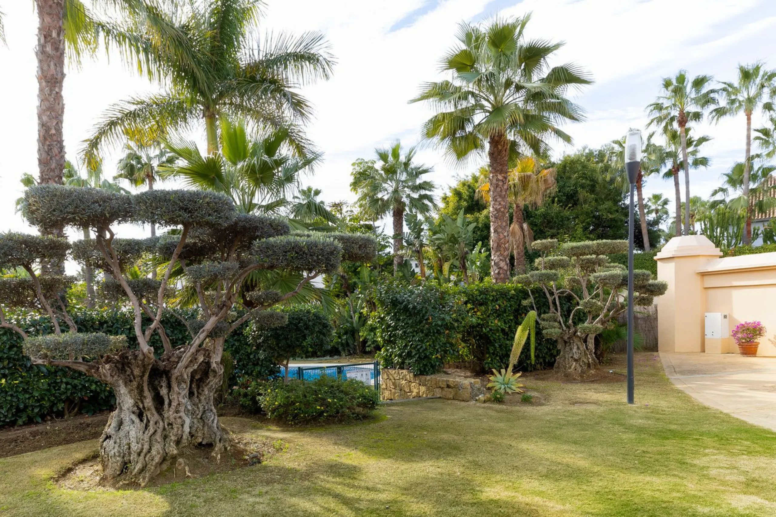 Very private South West facing garden apartment in this prestigious beachside development just meters from the sea only a short stroll to Puerto Banus. This 2 bed 2 bathroom 120m2 apartment has covered and uncovered terraces of 40m2 plus a private garden 