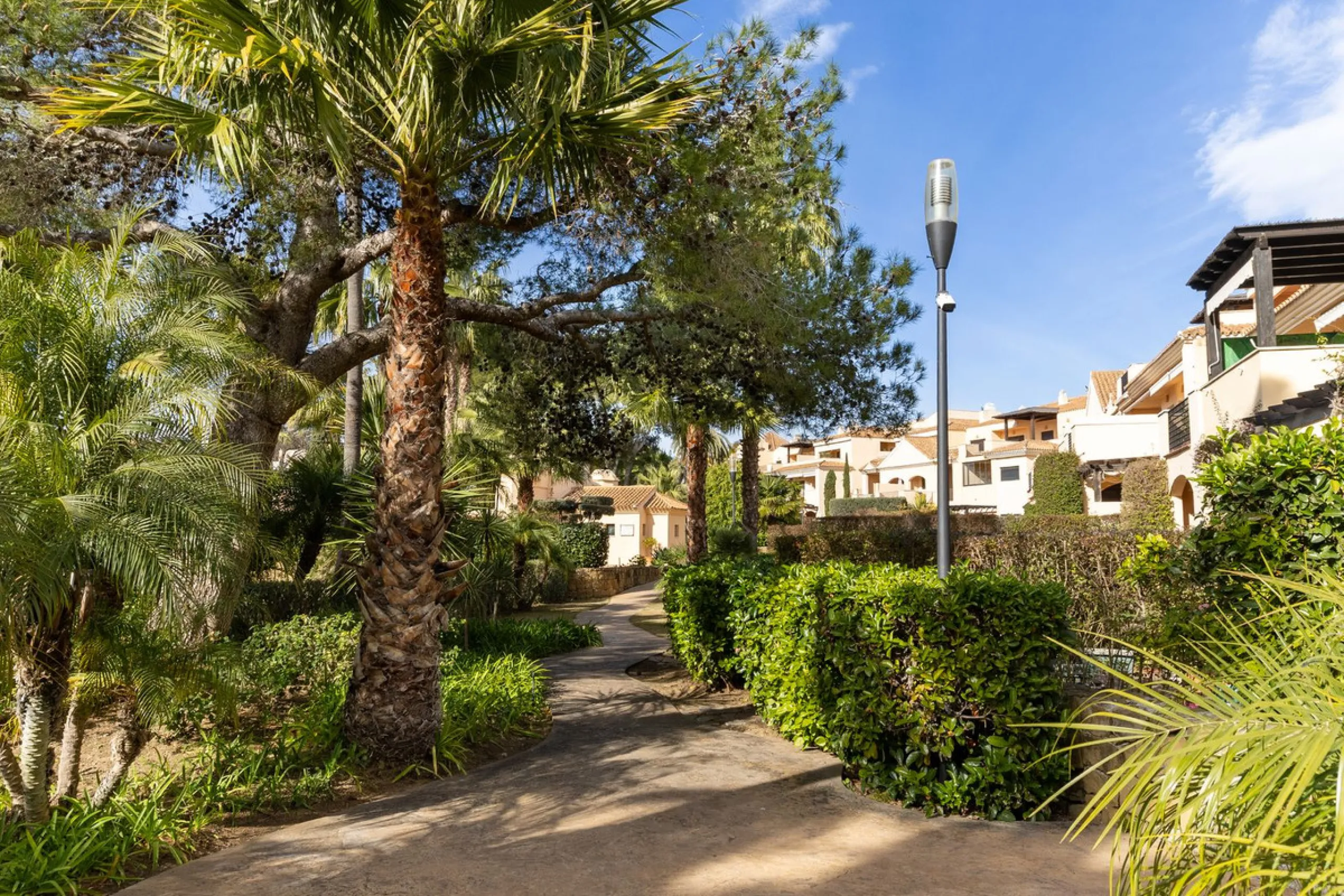 Very private South West facing garden apartment in this prestigious beachside development just meters from the sea only a short stroll to Puerto Banus. This 2 bed 2 bathroom 120m2 apartment has covered and uncovered terraces of 40m2 plus a private garden 