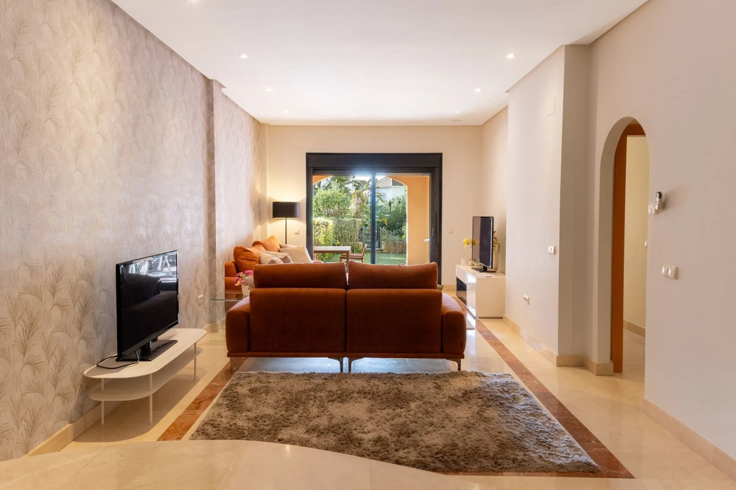 Very private South West facing garden apartment in this prestigious beachside development just meters from the sea only a short stroll to Puerto Banus. This 2 bed 2 bathroom 120m2 apartment has covered and uncovered terraces of 40m2 plus a private garden 