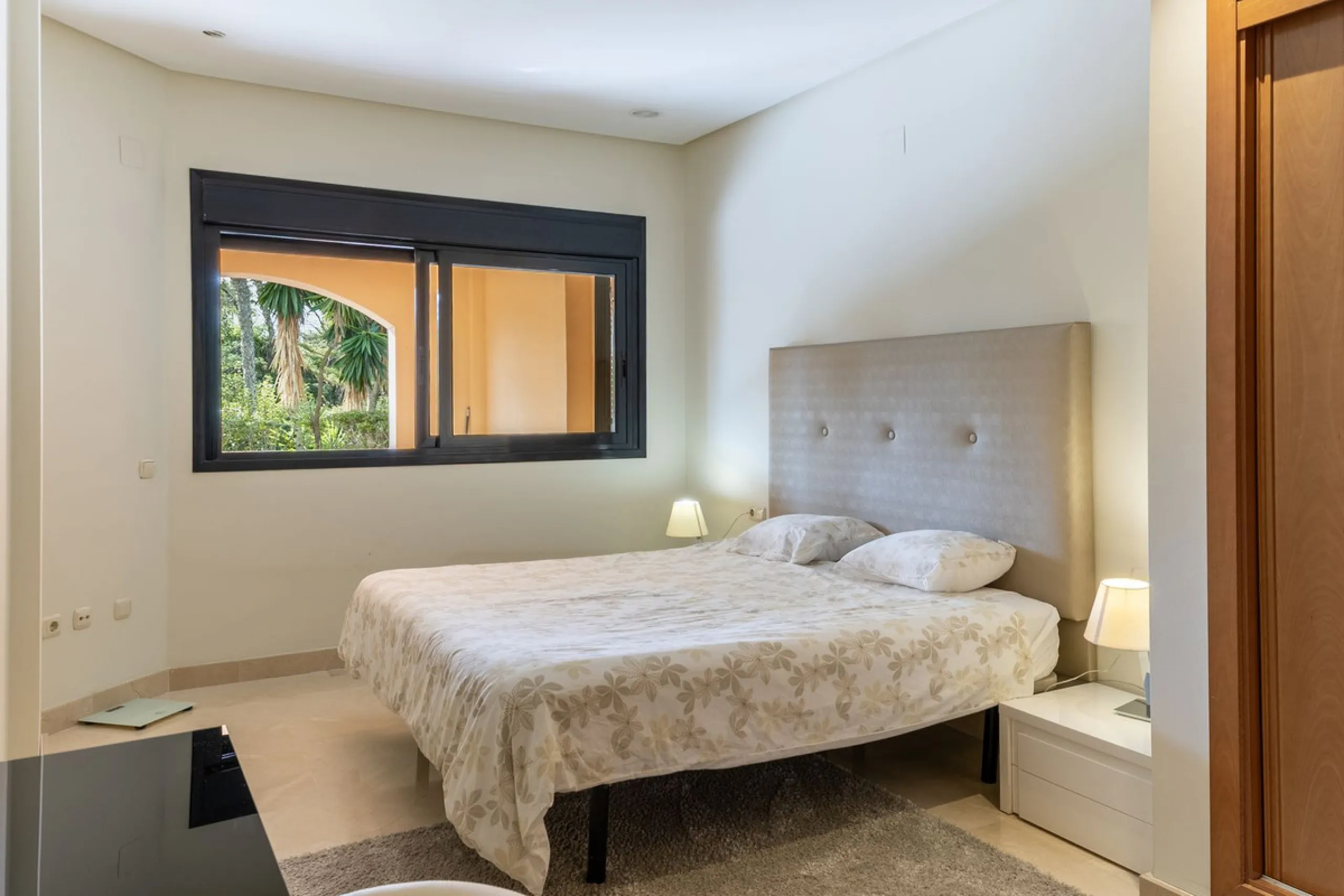 Very private South West facing garden apartment in this prestigious beachside development just meters from the sea only a short stroll to Puerto Banus. This 2 bed 2 bathroom 120m2 apartment has covered and uncovered terraces of 40m2 plus a private garden 
