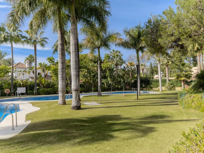 Very private South West facing garden apartment in this prestigious beachside development just meters from the sea only a short stroll to Puerto Banus. This 2 bed 2 bathroom 120m2 apartment has covered and uncovered terraces of 40m2 plus a private garden 