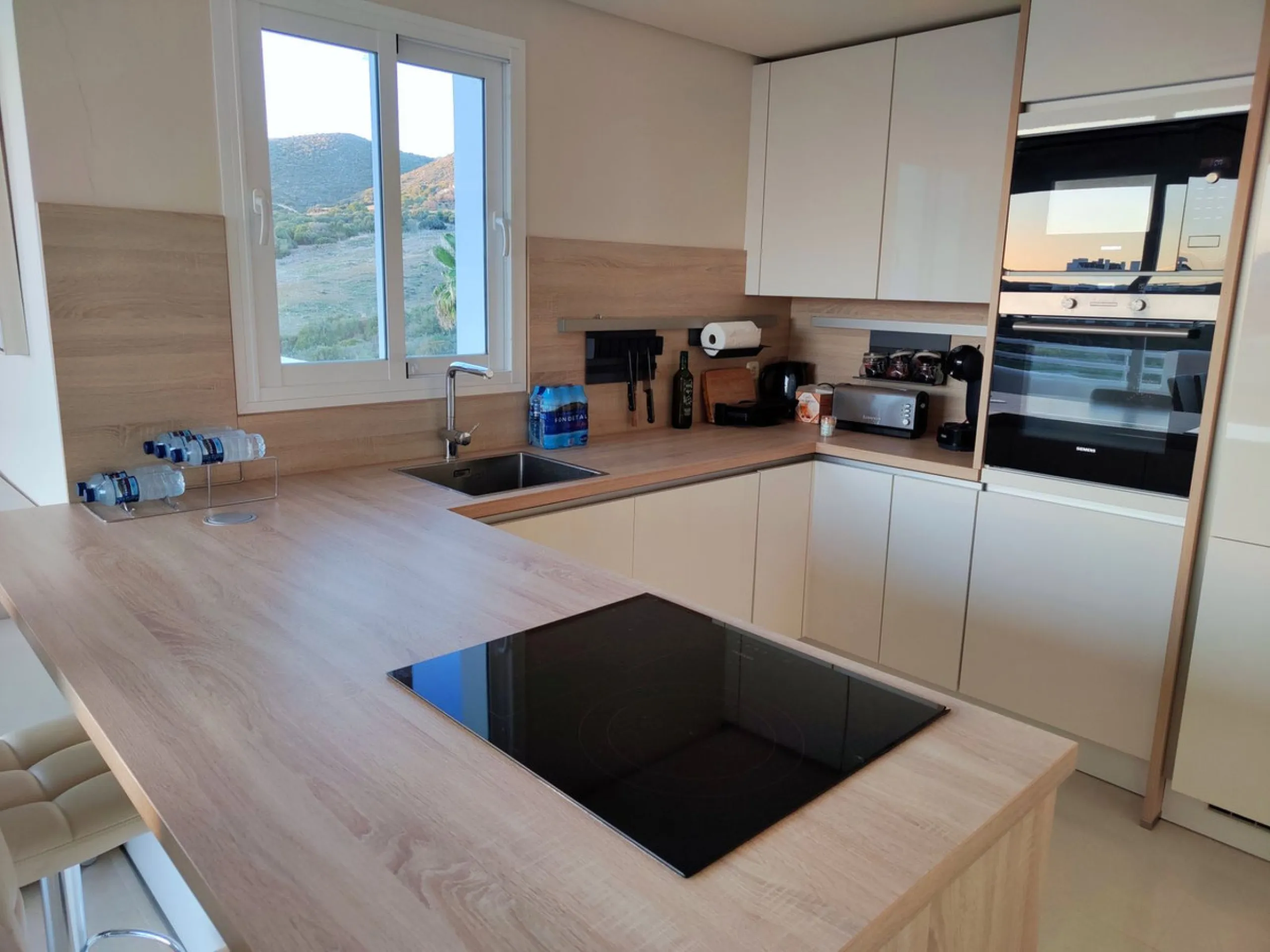 Accommodation for up to 4 guests is provided in a fully air-conditioned penthouse apartment with two double bedrooms, two bathrooms, a fully equipped kitchen with modern appliances, and a spacious living room. The 200 m² apartment includes a large terrace