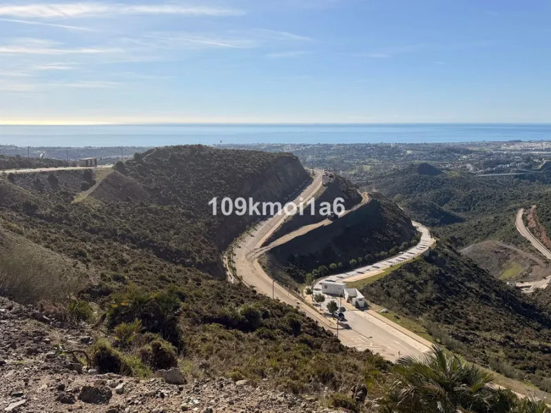 Build-Ready Plot with Panoramic Views in Gated Resort – Project & Licence Approved