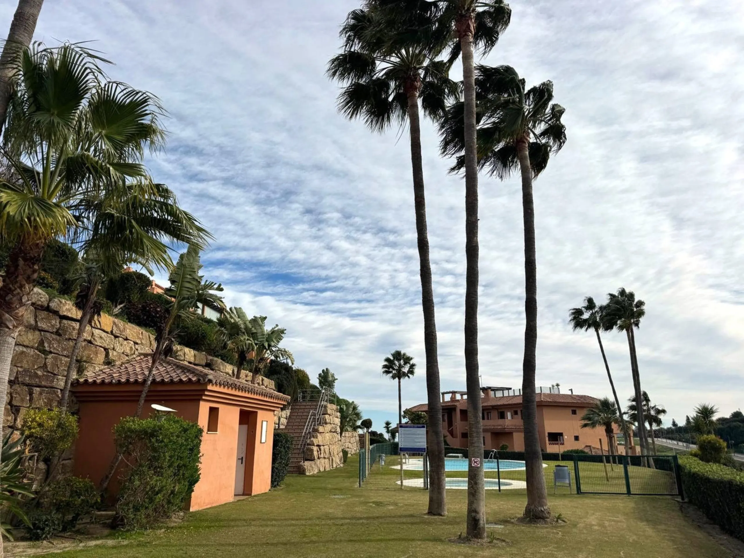 Discover your perfect slice of Costa del Sol life in Las Viñas del Golf, Casares Costa — a warm, inviting 2-bedroom, 2-bathroom apartment lovingly maintained by its current owner.