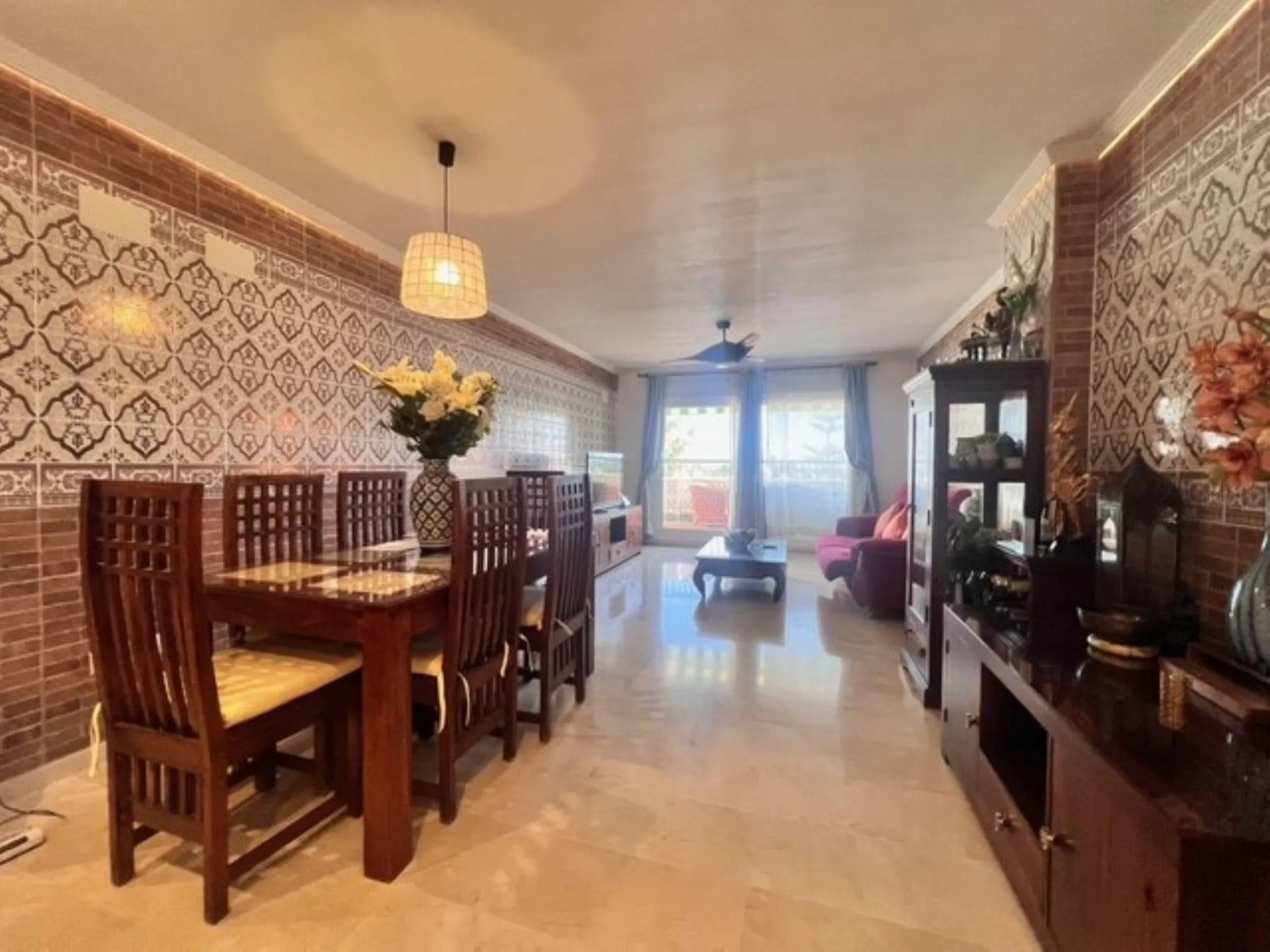 This charming top-floor apartment, located in the sought-after Guadalmina Baja, offers a comfortable and modern living experience. The apartment features two spacious bedrooms and two renovated bathrooms. The open-concept layout creates a seamless flow be