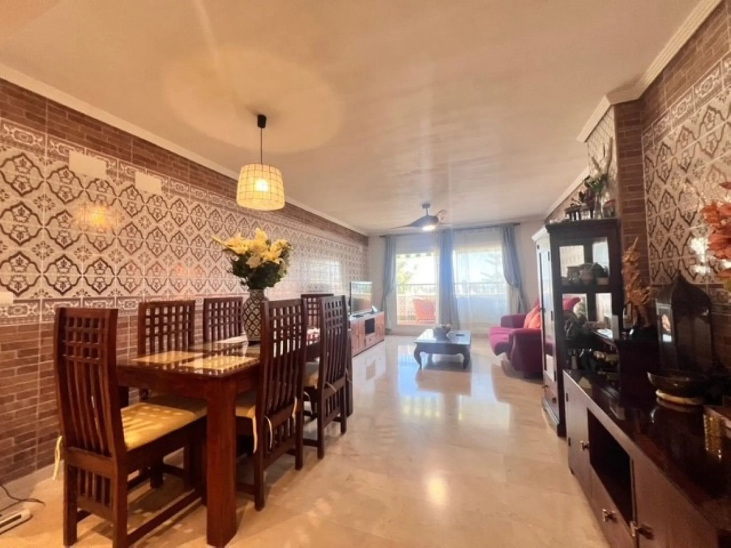 This charming top-floor apartment, located in the sought-after Guadalmina Baja, offers a comfortable and modern living experience. The apartment features two spacious bedrooms and two renovated bathrooms. The open-concept layout creates a seamless flow be
