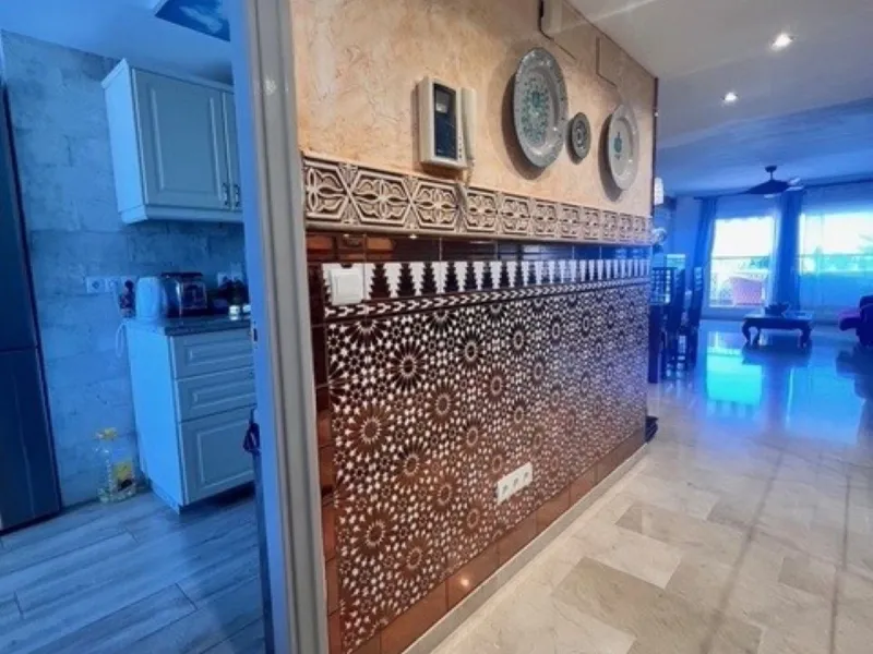 This charming top-floor apartment, located in the sought-after Guadalmina Baja, offers a comfortable and modern living experience. The apartment features two spacious bedrooms and two renovated bathrooms. The open-concept layout creates a seamless flow be