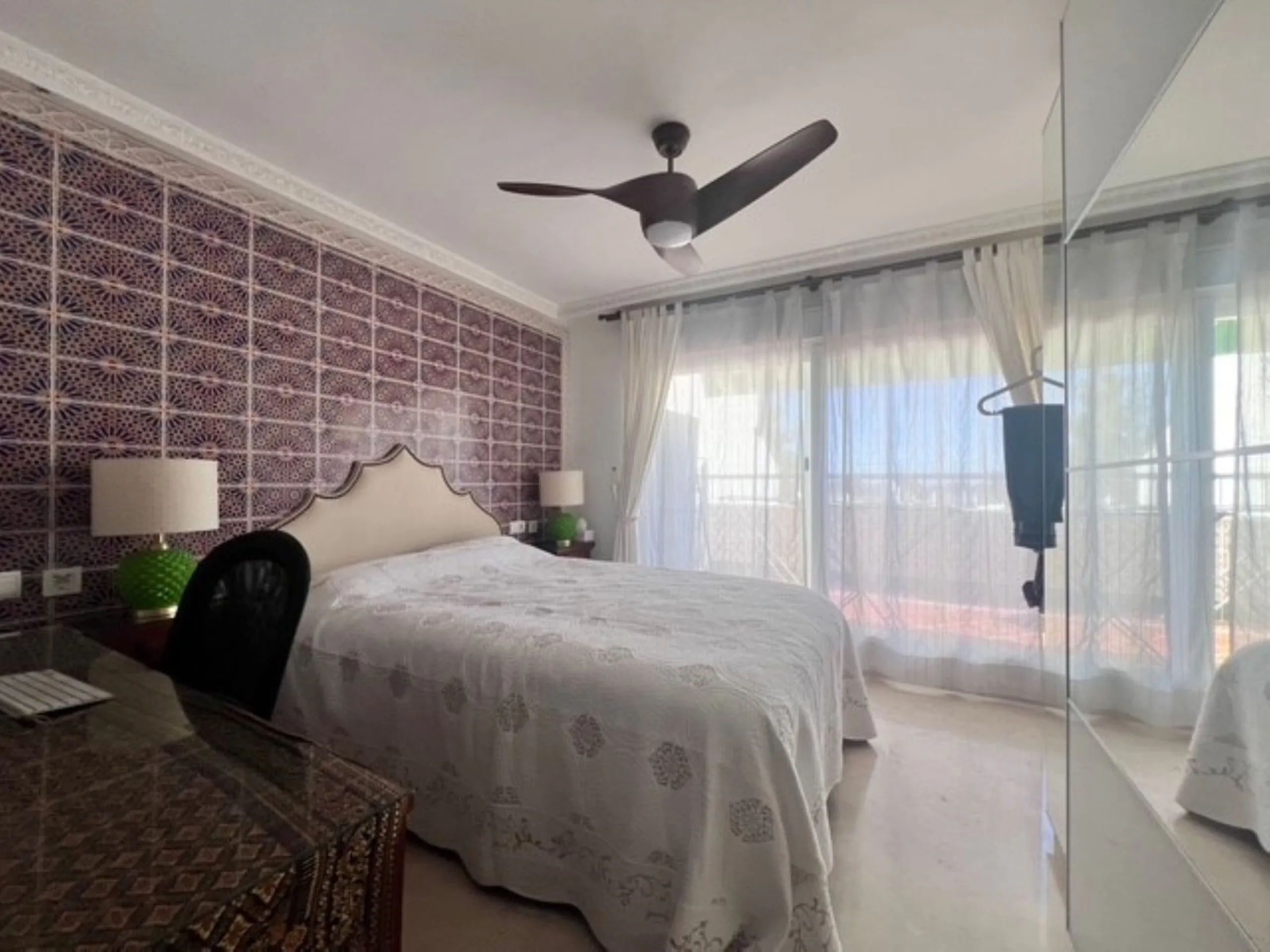 This charming top-floor apartment, located in the sought-after Guadalmina Baja, offers a comfortable and modern living experience. The apartment features two spacious bedrooms and two renovated bathrooms. The open-concept layout creates a seamless flow be