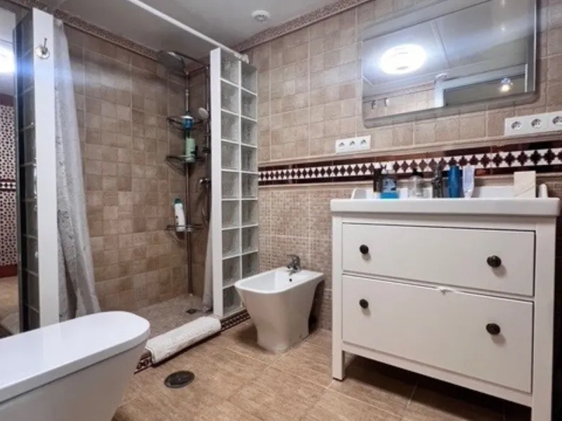 This charming top-floor apartment, located in the sought-after Guadalmina Baja, offers a comfortable and modern living experience. The apartment features two spacious bedrooms and two renovated bathrooms. The open-concept layout creates a seamless flow be