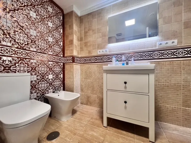 This charming top-floor apartment, located in the sought-after Guadalmina Baja, offers a comfortable and modern living experience. The apartment features two spacious bedrooms and two renovated bathrooms. The open-concept layout creates a seamless flow be