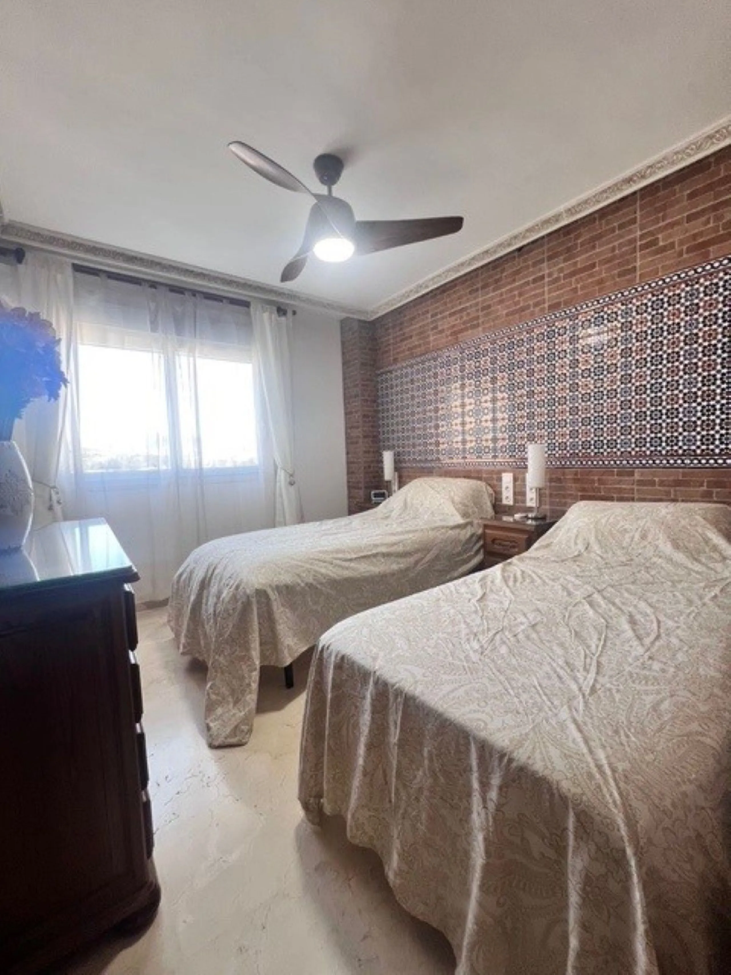 This charming top-floor apartment, located in the sought-after Guadalmina Baja, offers a comfortable and modern living experience. The apartment features two spacious bedrooms and two renovated bathrooms. The open-concept layout creates a seamless flow be