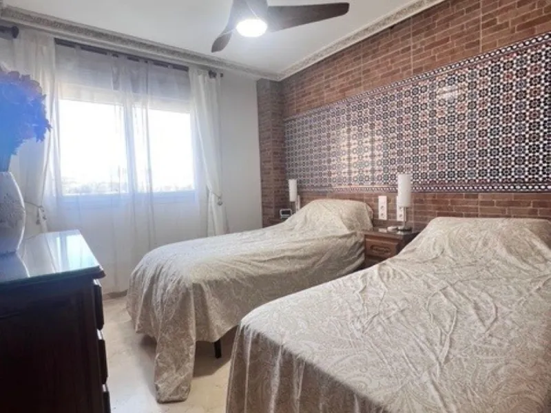 This charming top-floor apartment, located in the sought-after Guadalmina Baja, offers a comfortable and modern living experience. The apartment features two spacious bedrooms and two renovated bathrooms. The open-concept layout creates a seamless flow be