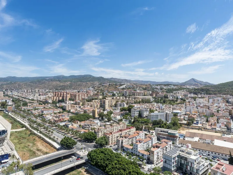 Experience elevated city living in this exceptional 24th-floor apartment in one of Málaga's most exciting new residential developments. Perfectly positioned in the heart of the city, this sleek and modern home offers spectacular panoramic views over the c