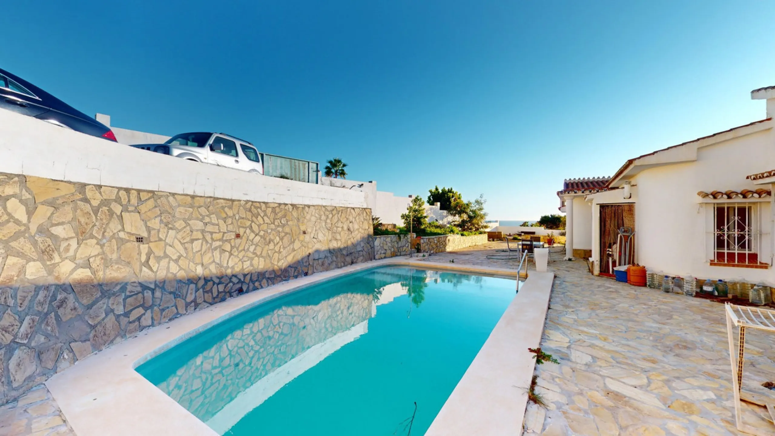 Discover your dream home in the charming seaside village of Benajarafe! This beautifully modernized property offers everything you need for luxurious Mediterranean living. The main house features two spacious bedrooms and a sleek, contemporary bathroom. A
