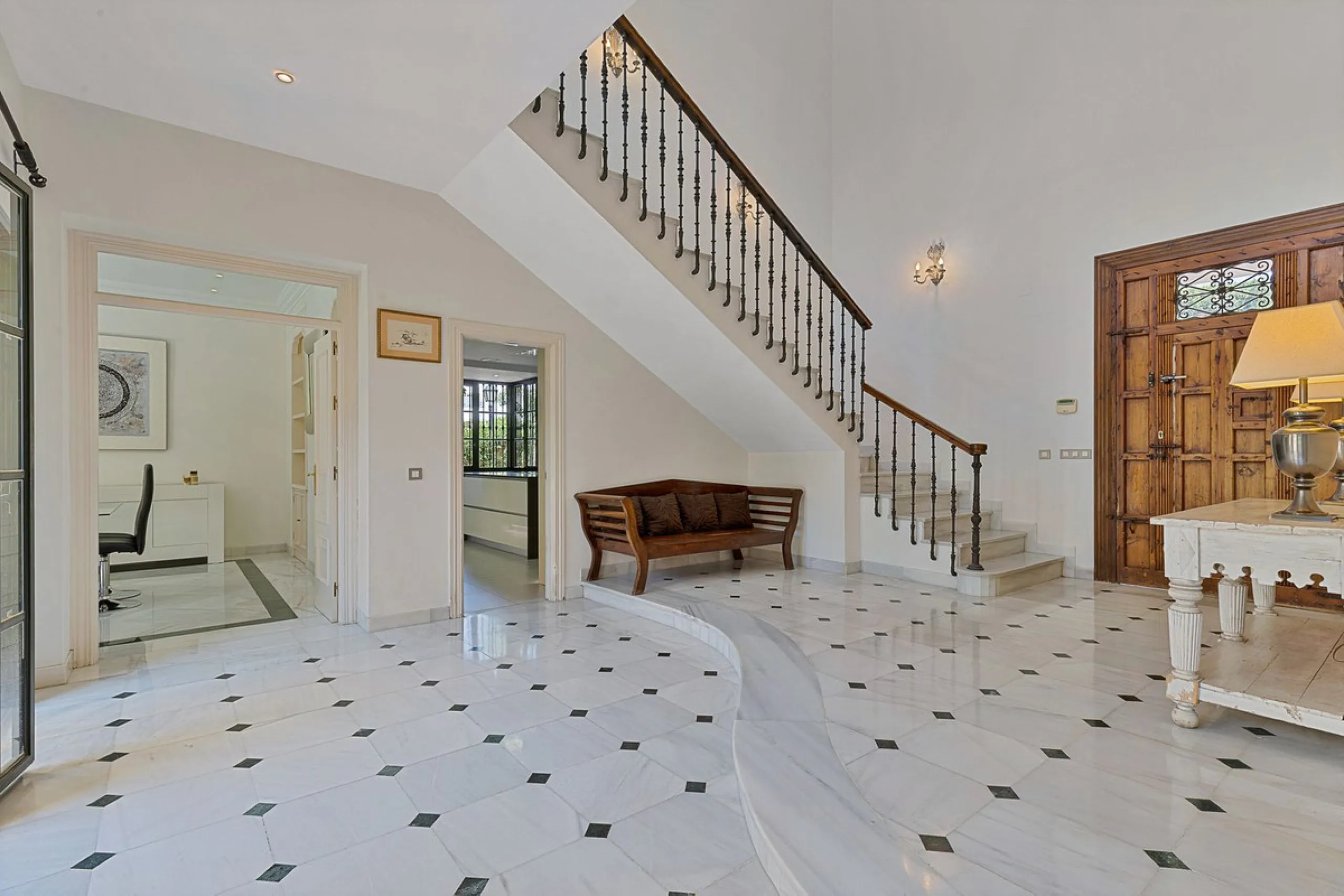 This classic Andalusian-style villa, set within the prestigious residential enclave of Casasola, Guadalmina Baja, represents a rare opportunity to acquire a substantial family home just moments from the sea, with exceptional scope for refurbishment and pe