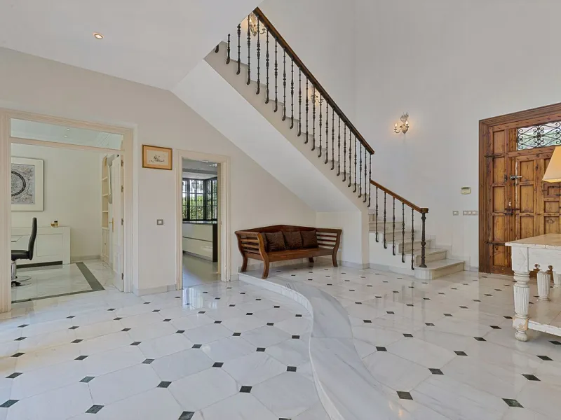 This classic Andalusian-style villa, set within the prestigious residential enclave of Casasola, Guadalmina Baja, represents a rare opportunity to acquire a substantial family home just moments from the sea, with exceptional scope for refurbishment and pe